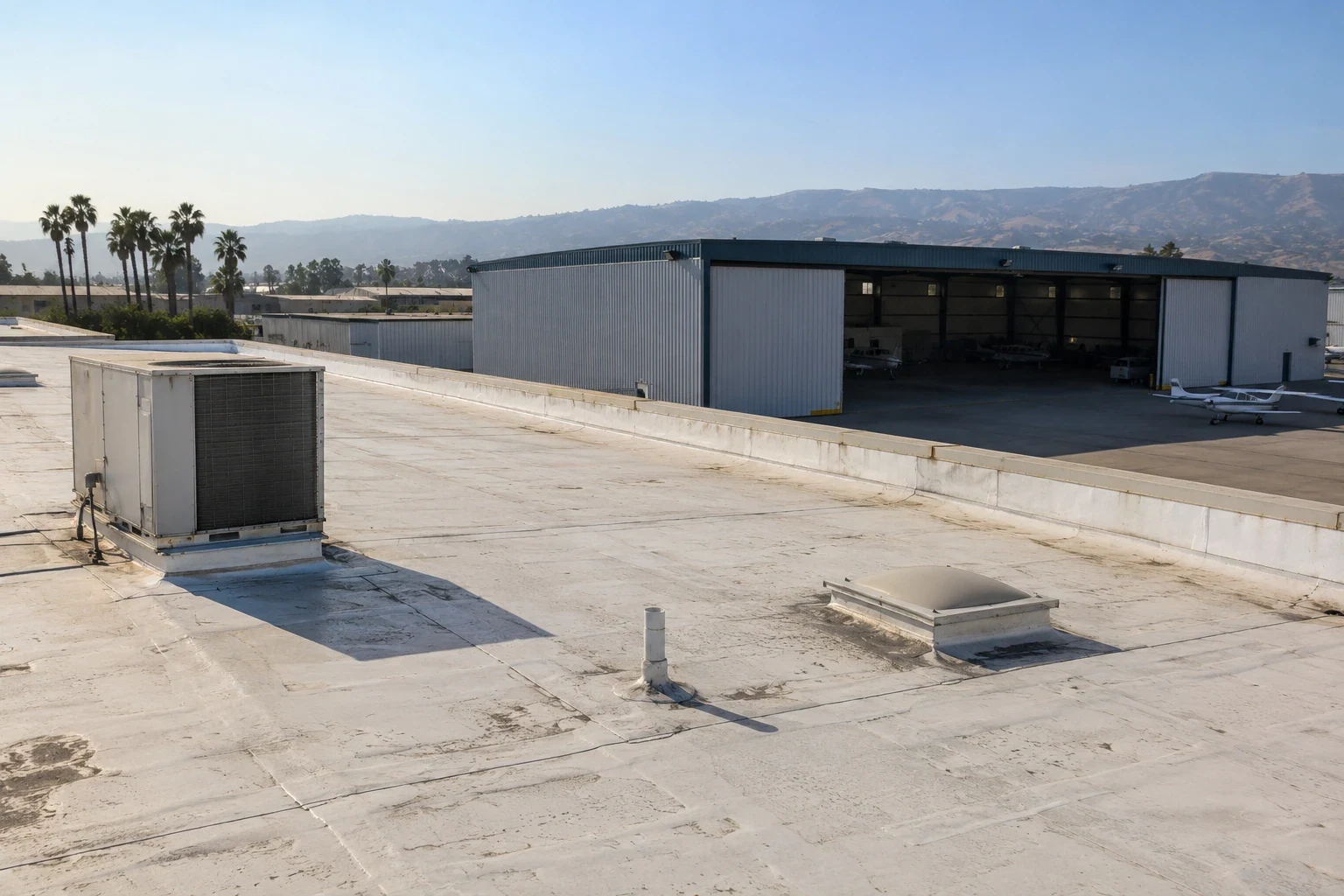 Office Building Roofing in Jurupa Valley, CA - Rebuild the wall-side layers through the finished detail