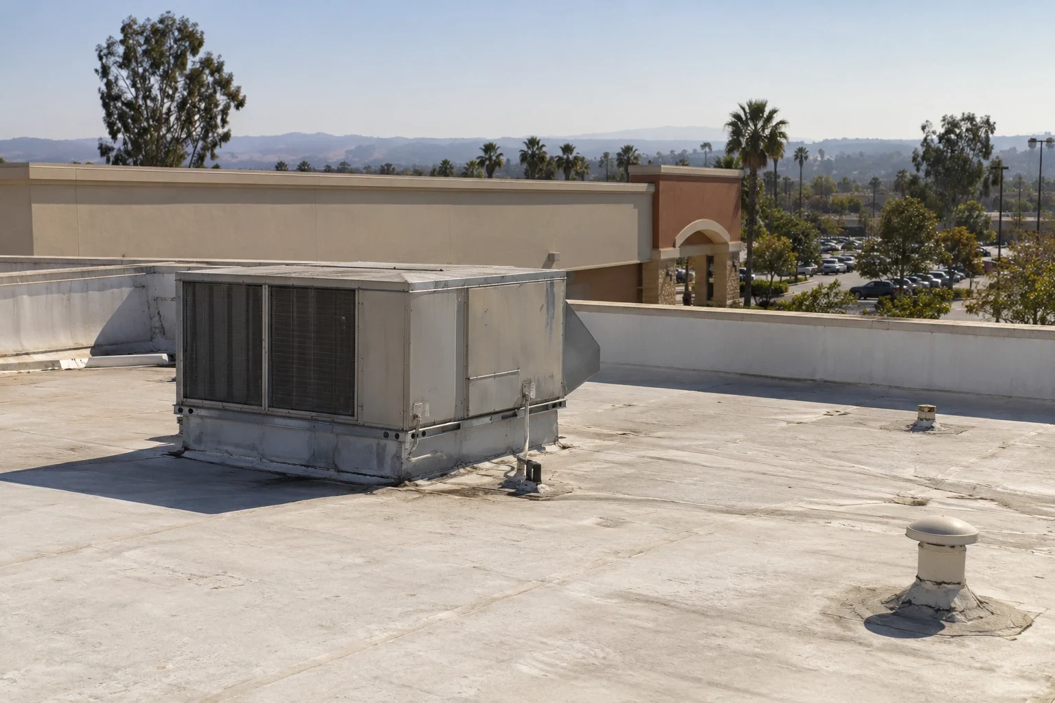 Office Building Roofing in Jurupa Valley, CA - Trace the parapet connection through its backing